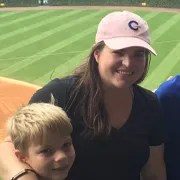 Man and young girl smiling, looking forward to meeting visitors